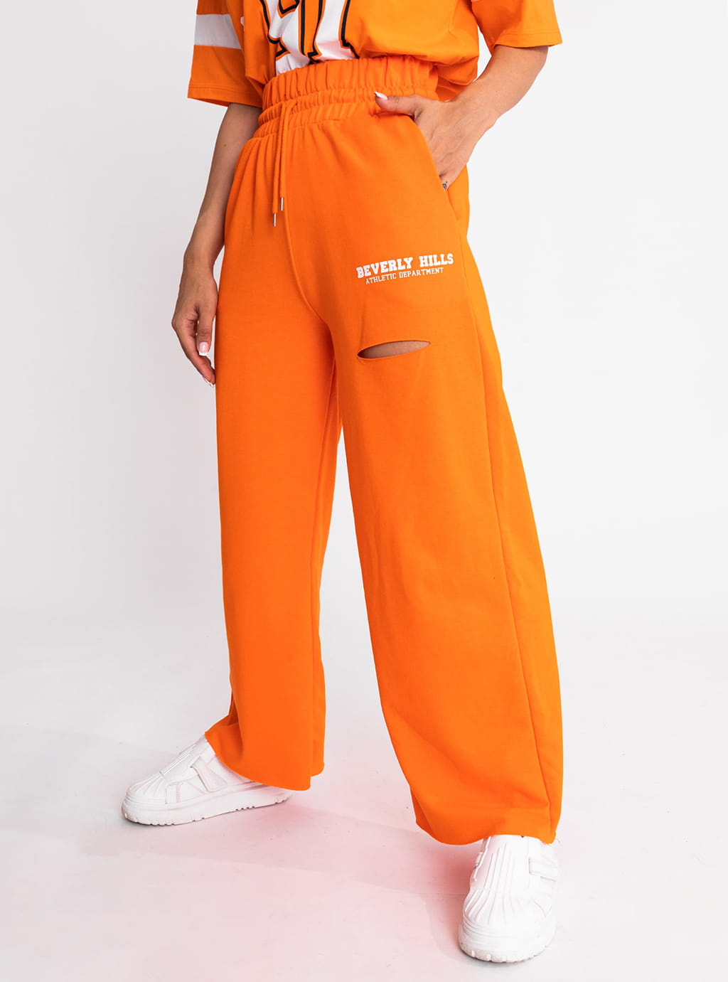 Lolli- spodnie z szeroką nogawką, ozdobnym nadrukiem i rozcięciem- pomarańczowe